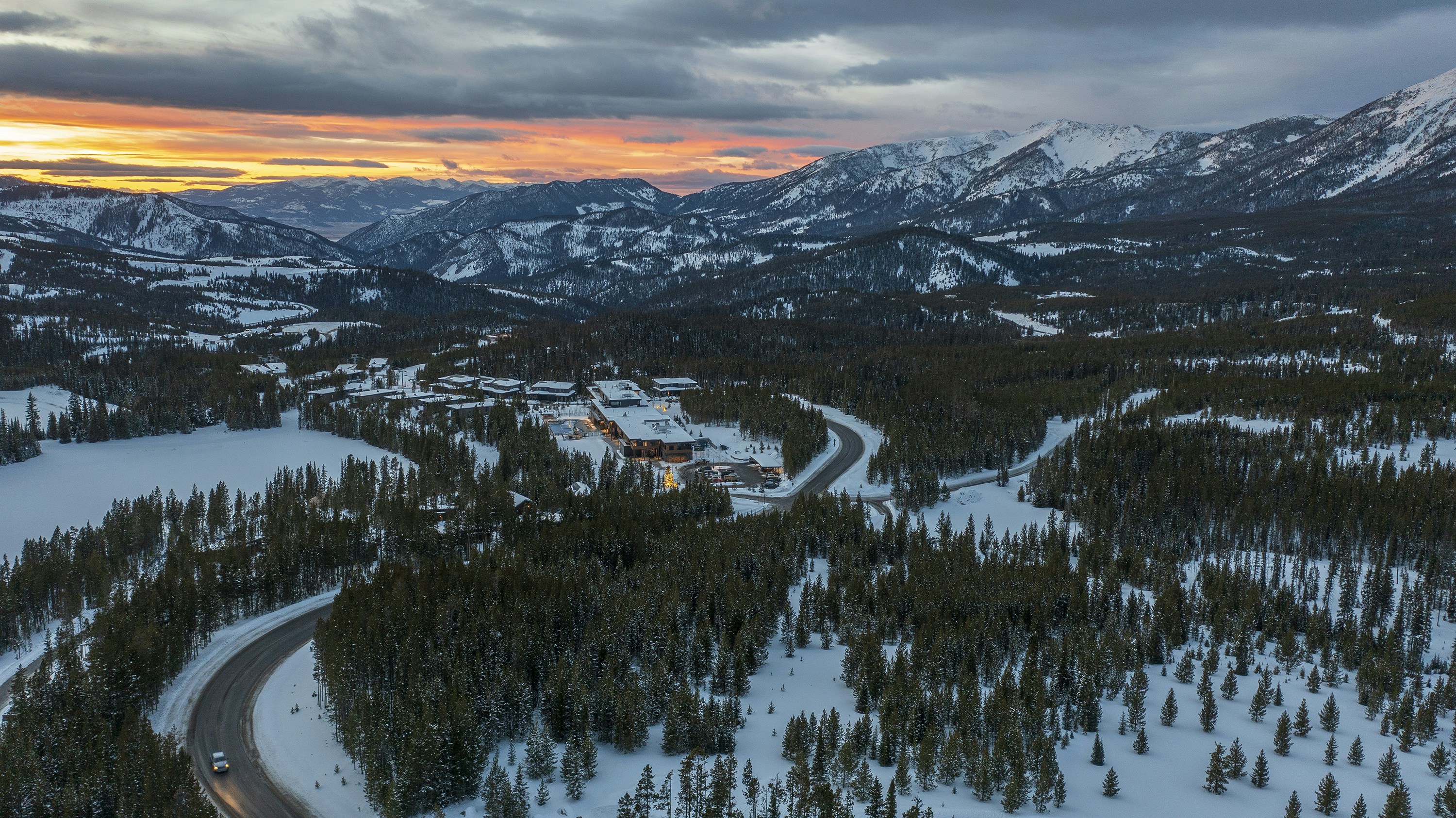 An aerial view of a road in the mountains, 
