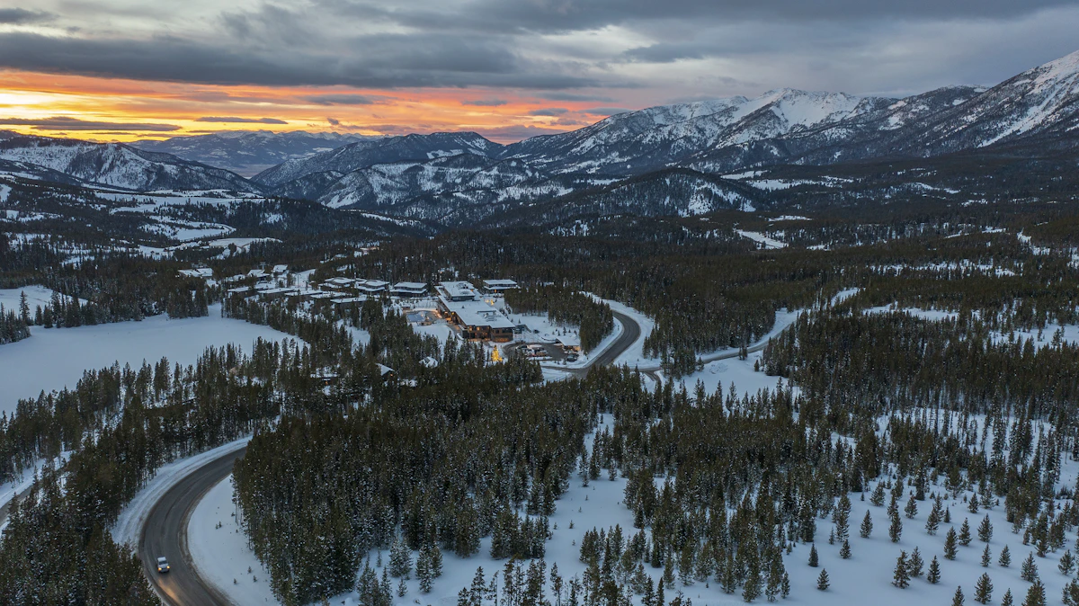 Aerial view of Big Sky ski area and forested mountains in Montana