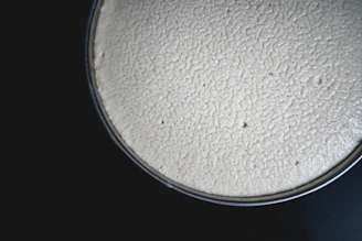 A close up of a white substance on a black background