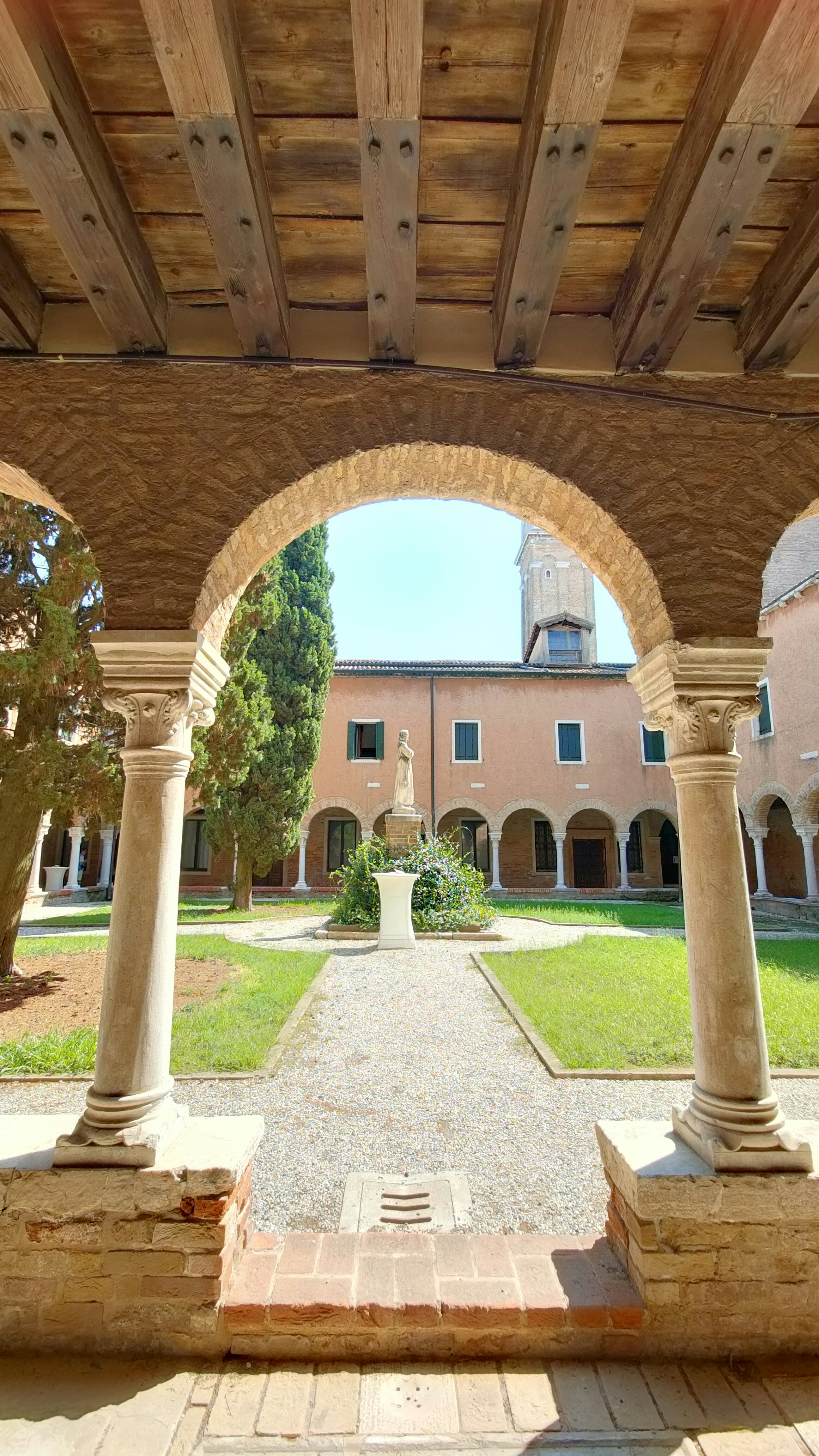woman wearing yellow long-sleeved dress under white clouds and blue sky during daytime