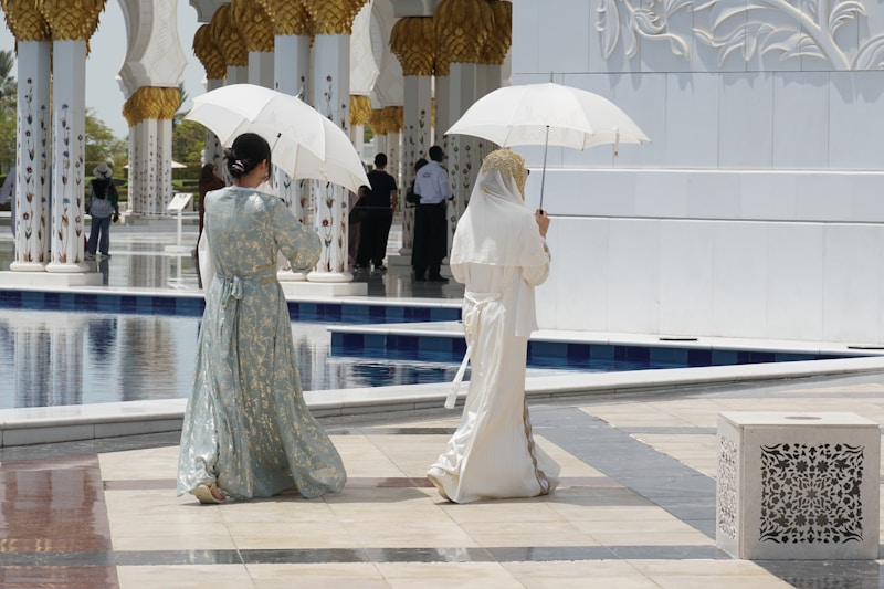 Chic friends under umbrellas