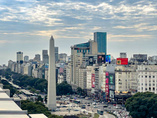 A view of a city with tall buildings and a obelisk