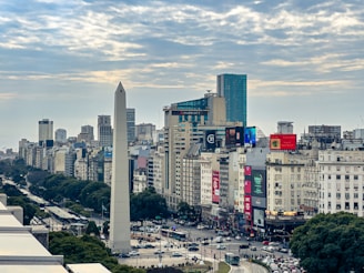 A view of a city with tall buildings and a obelisk