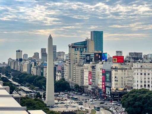 A view of a city with tall buildings and a obelisk