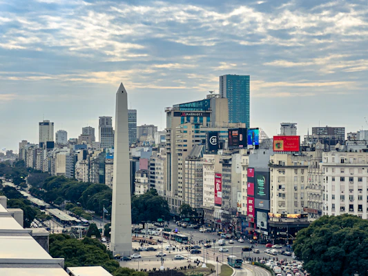 A view of a city with tall buildings and a obelisk