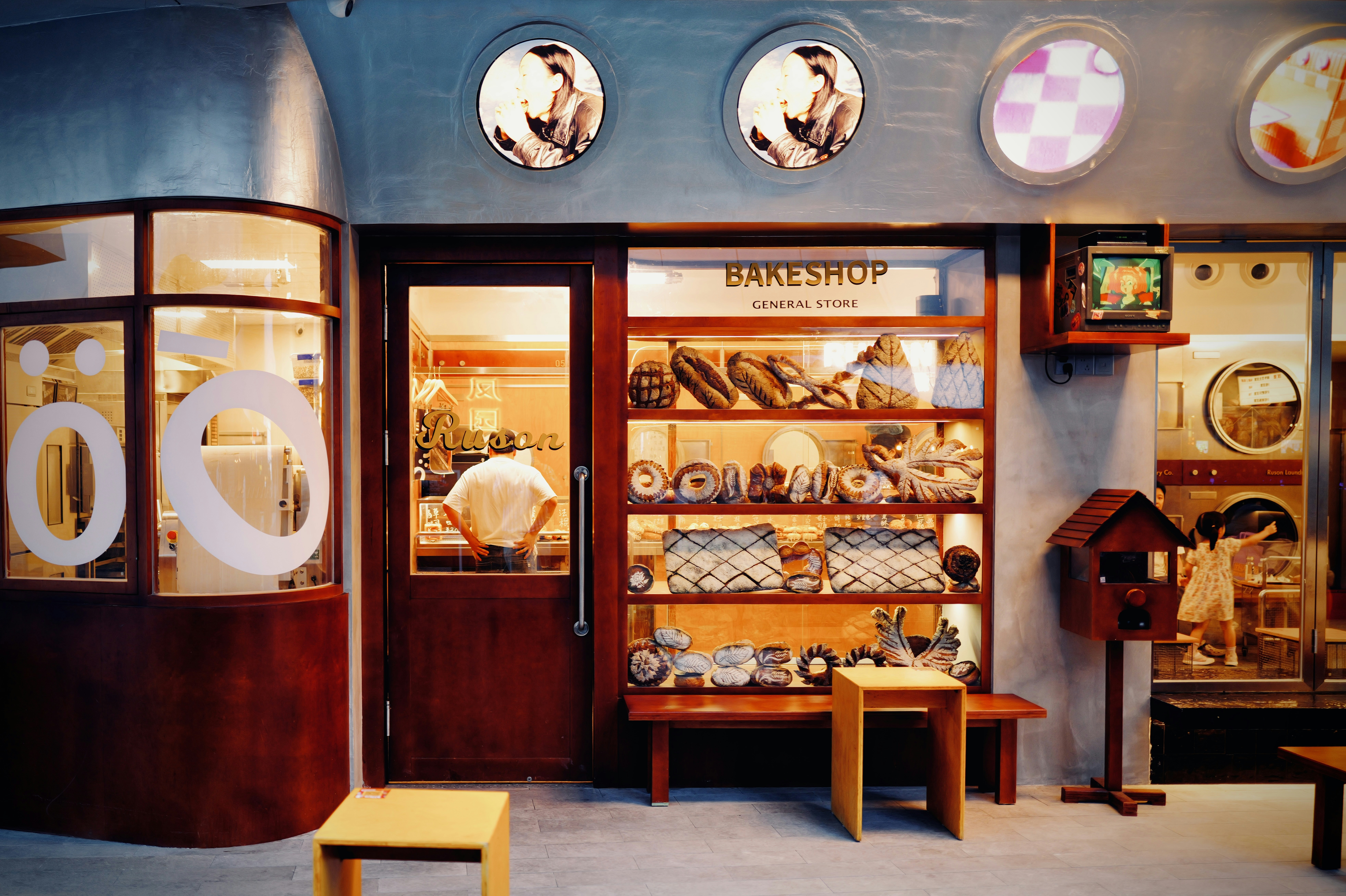 A store front with a lot of different items on display