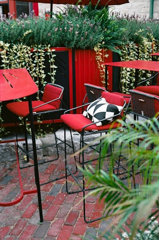 A bunch of chairs that are sitting outside