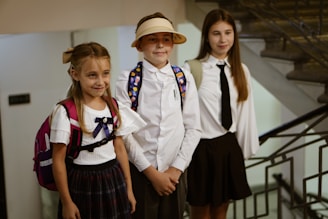 A group of young children standing next to each other