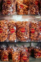 A bunch of bags of nuts sitting on a shelf