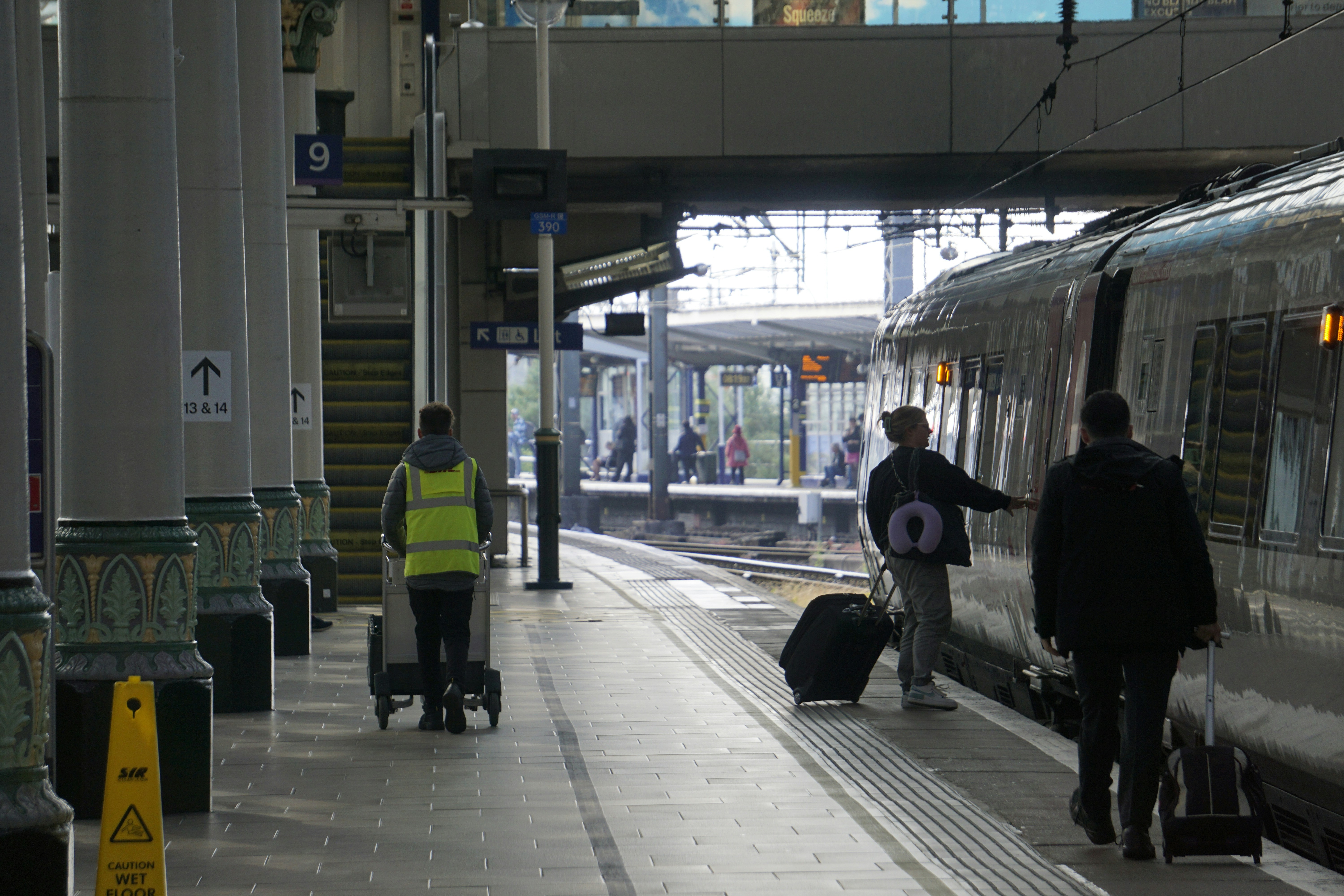 A CrossCountry Class 221 waiting to depart Manchester Piccadilly station, boarding passengers on platform 9