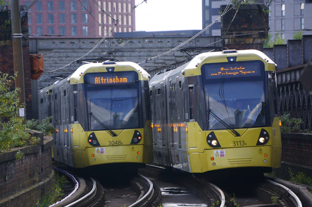 A couple of trains that are on some tracks