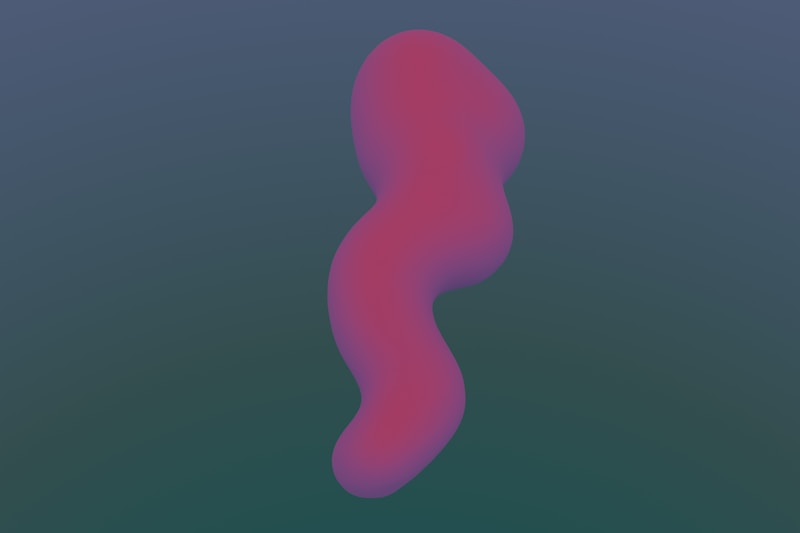 A blurry image of a pink object on a blue background