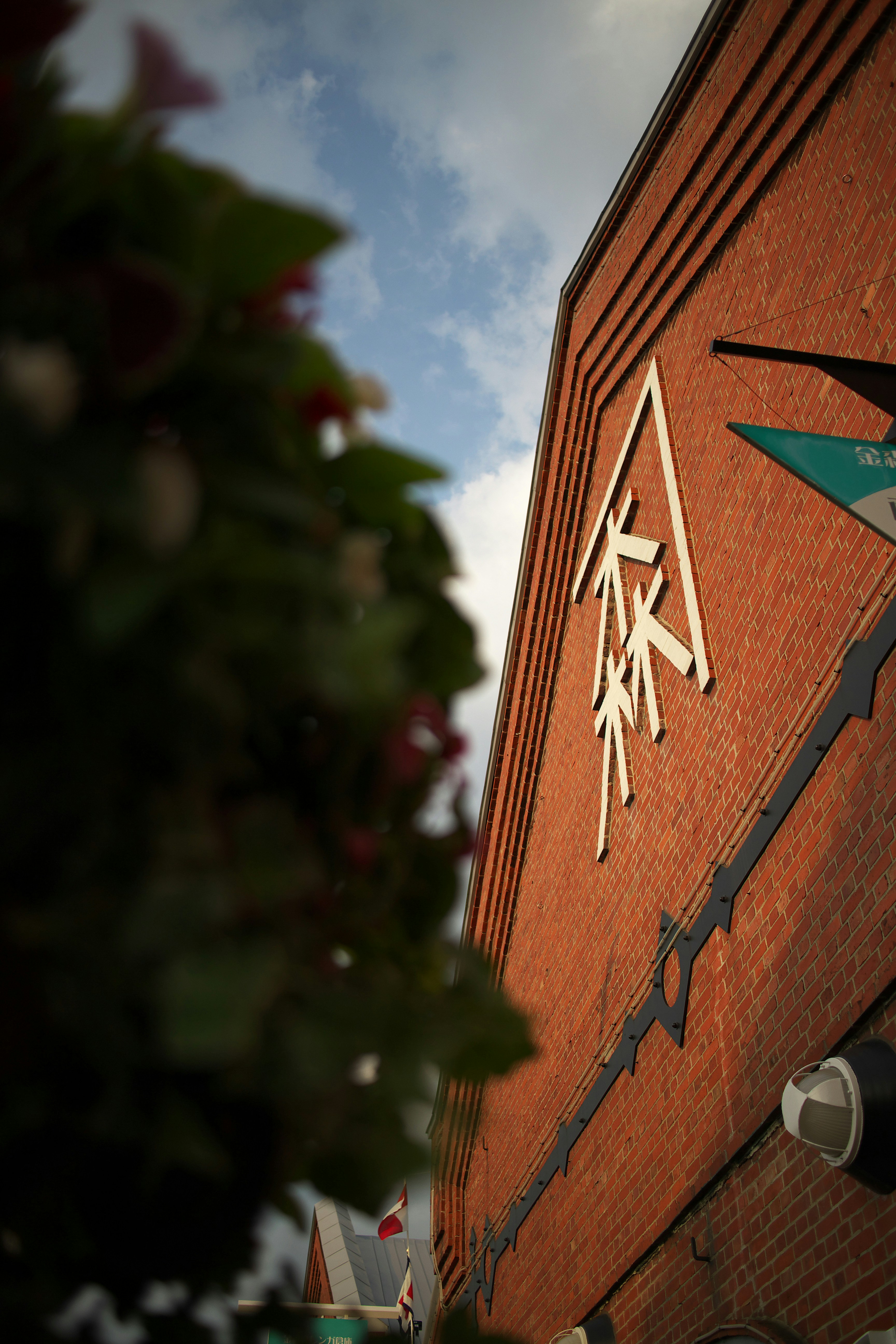 A brick building with a clock on the side of it