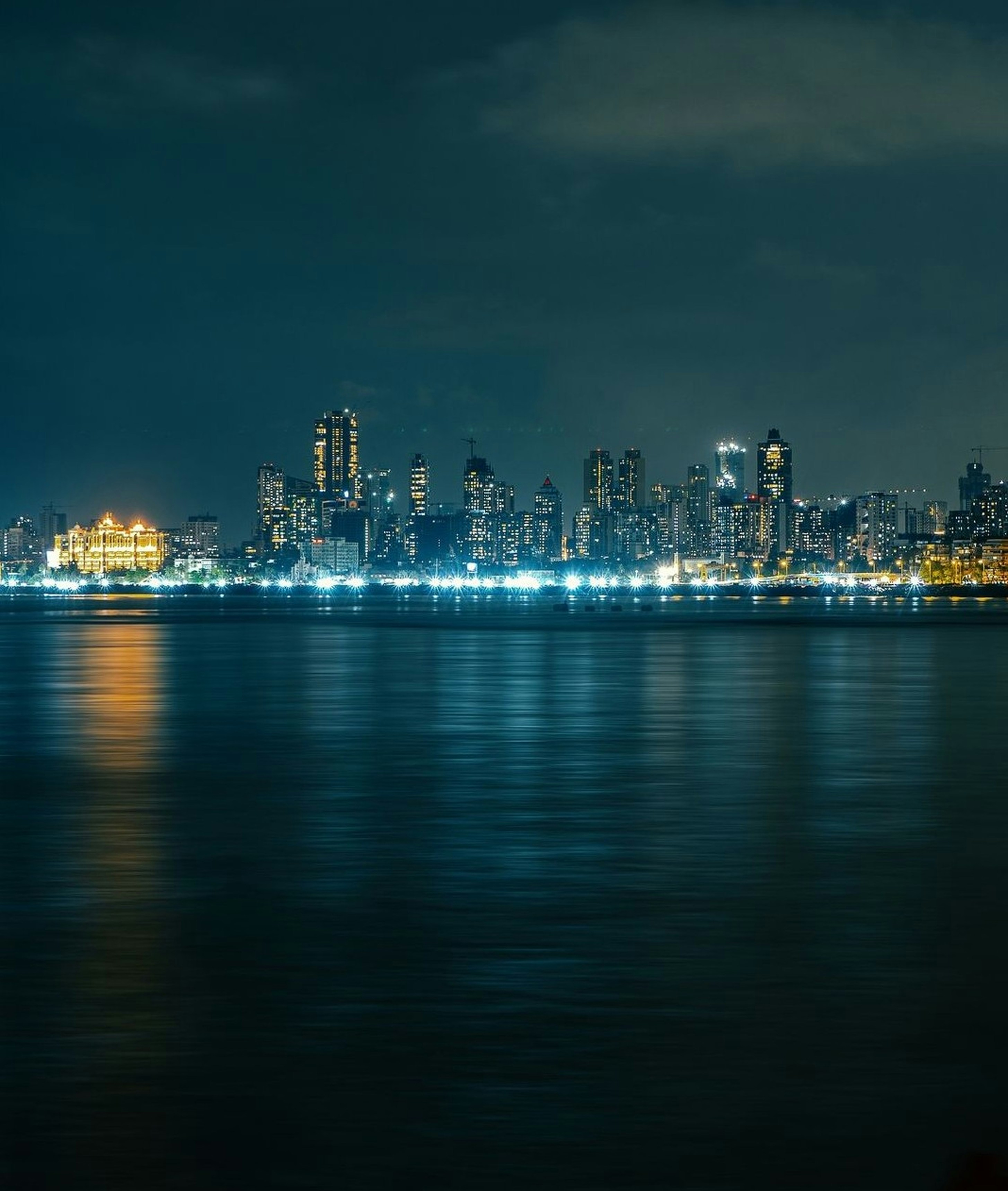 A view of a city at night from across the water