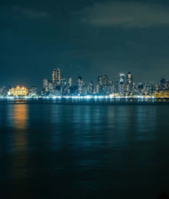 A view of a city at night from across the water