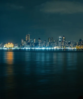 A view of a city at night from across the water