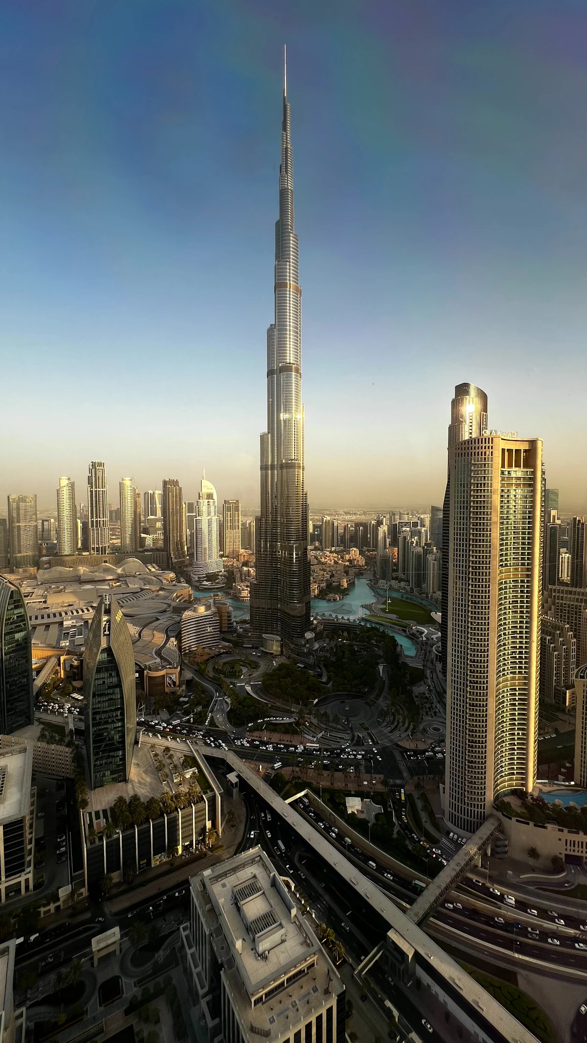 Dubai skyline with Burj Khalifa and modern skyscrapers at sunset over the desert city
