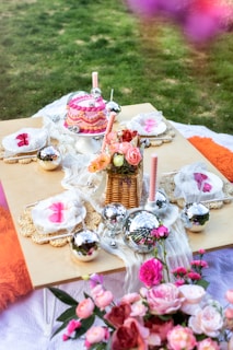 A table topped with lots of cakes and cupcakes