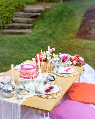 A table with a cake and candles on it