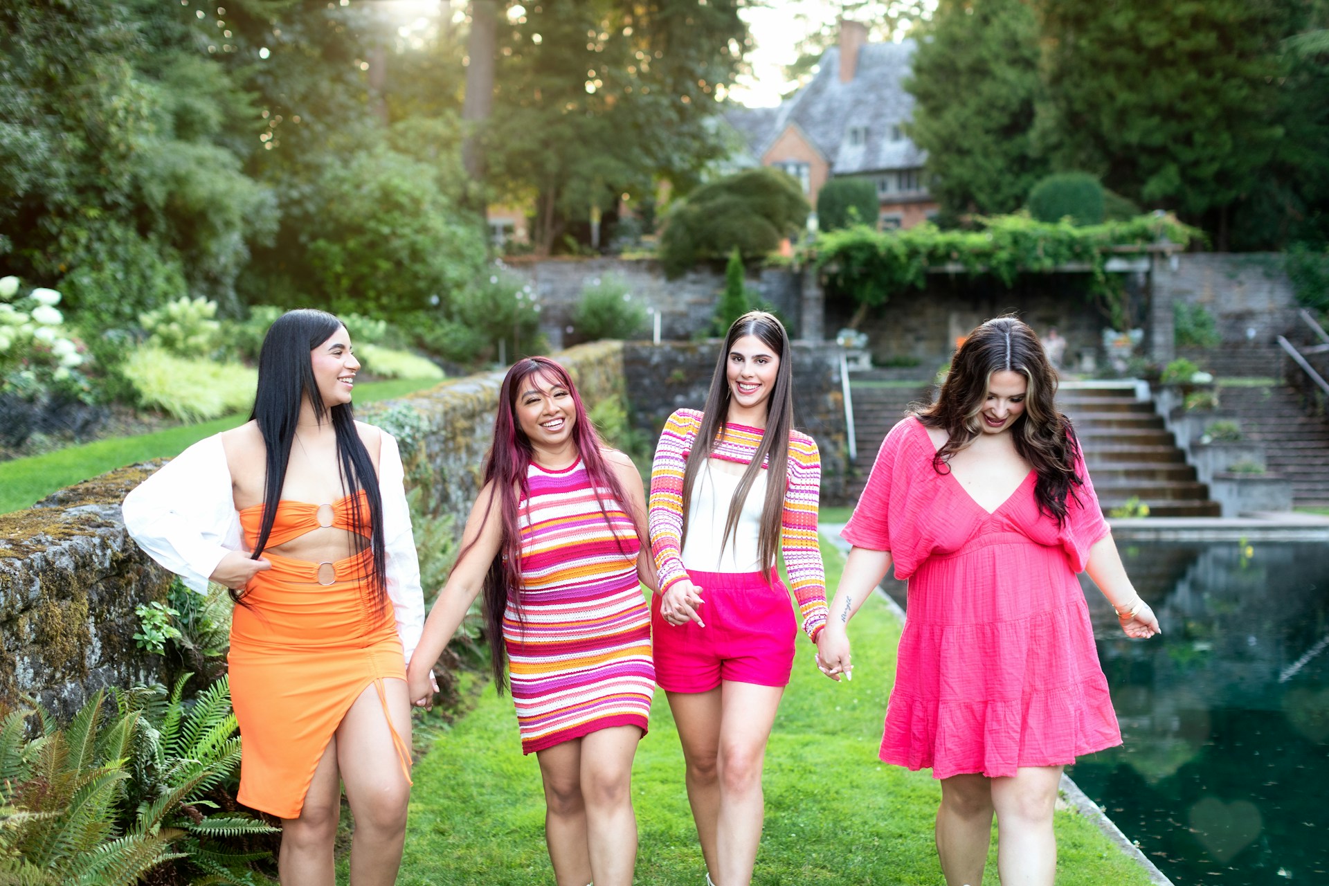 A group of women walking across a lush green field