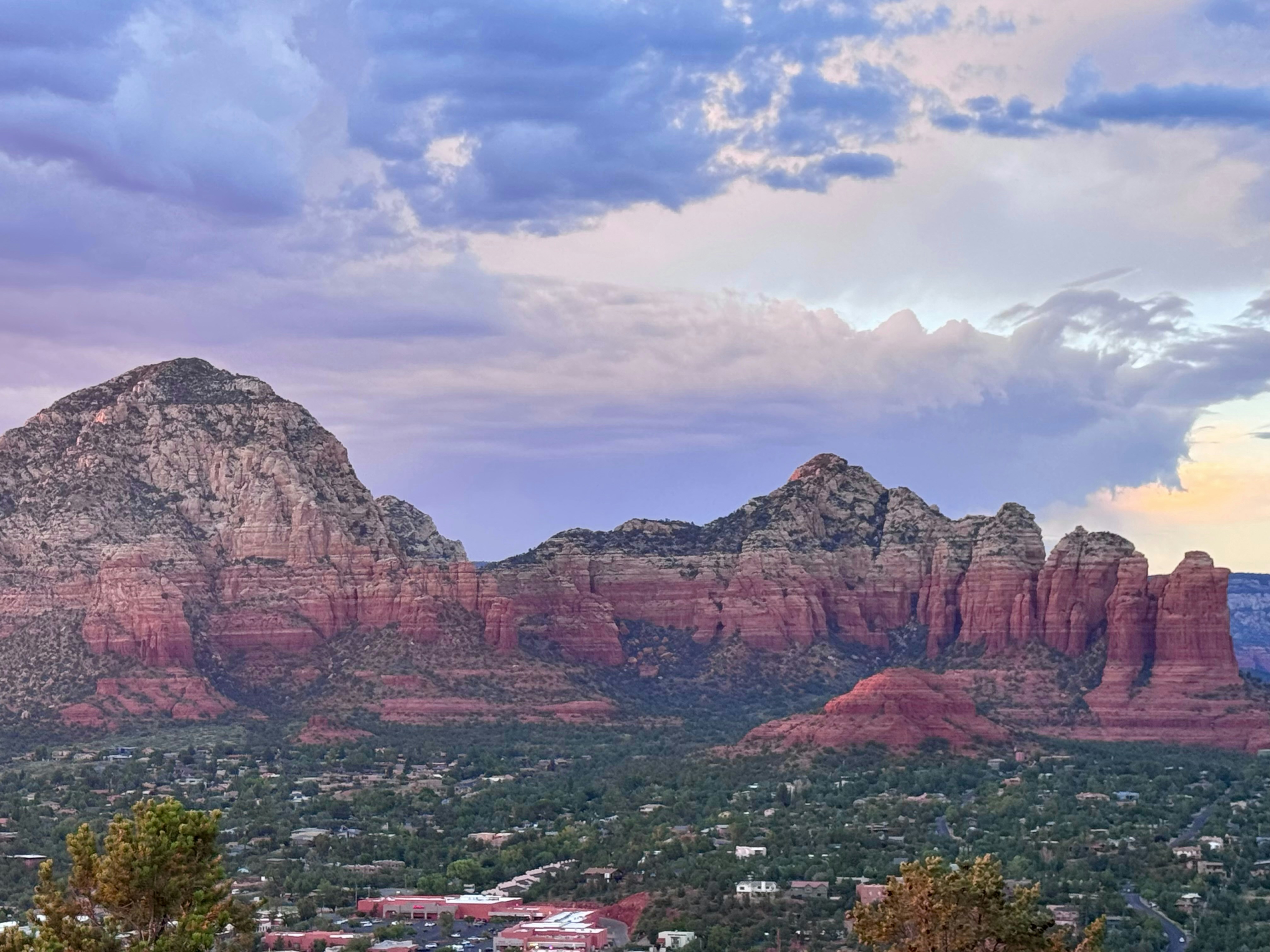 A view of the mountains and the city of sedona, A beautiful evening in Sedona