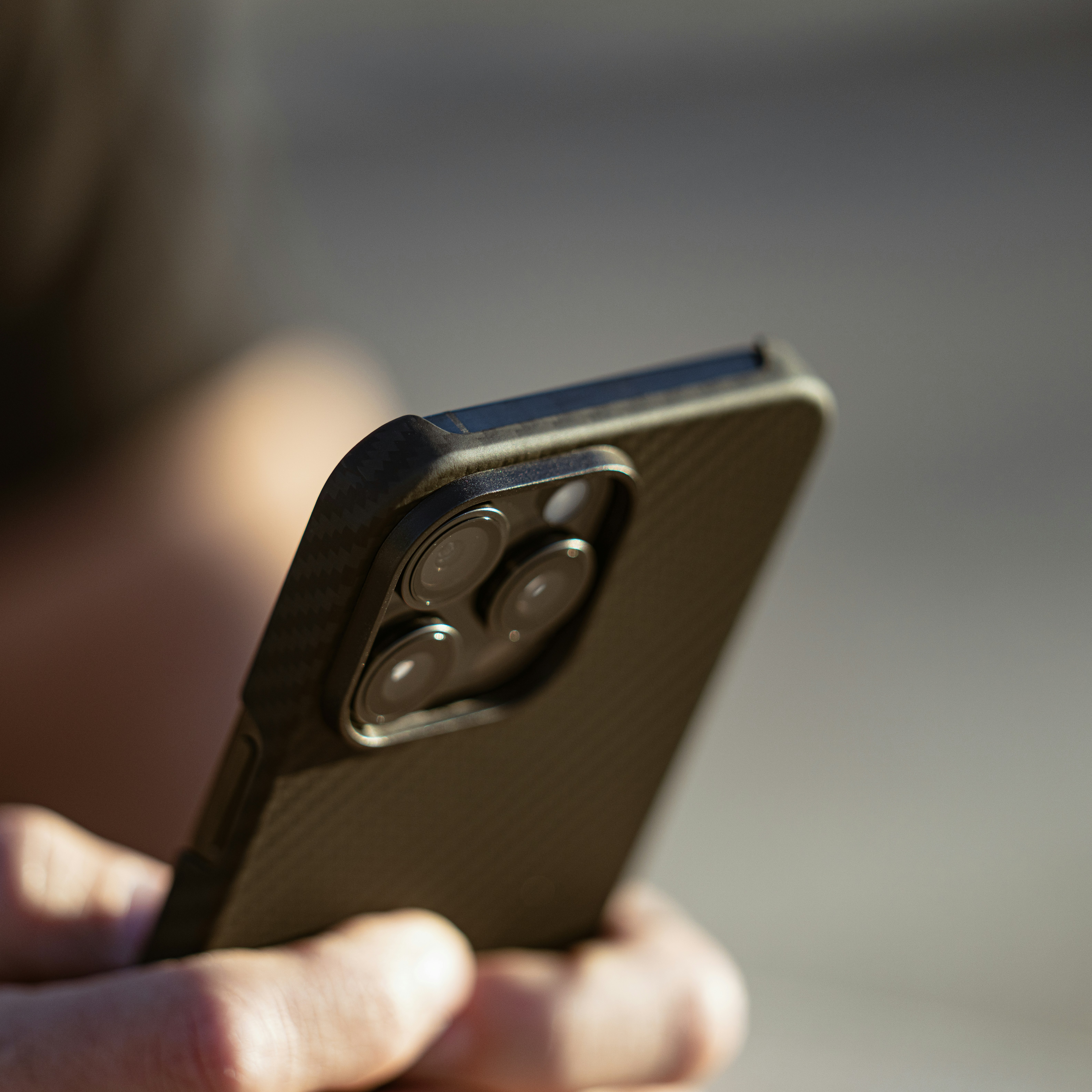A close up of a person holding a cell phone