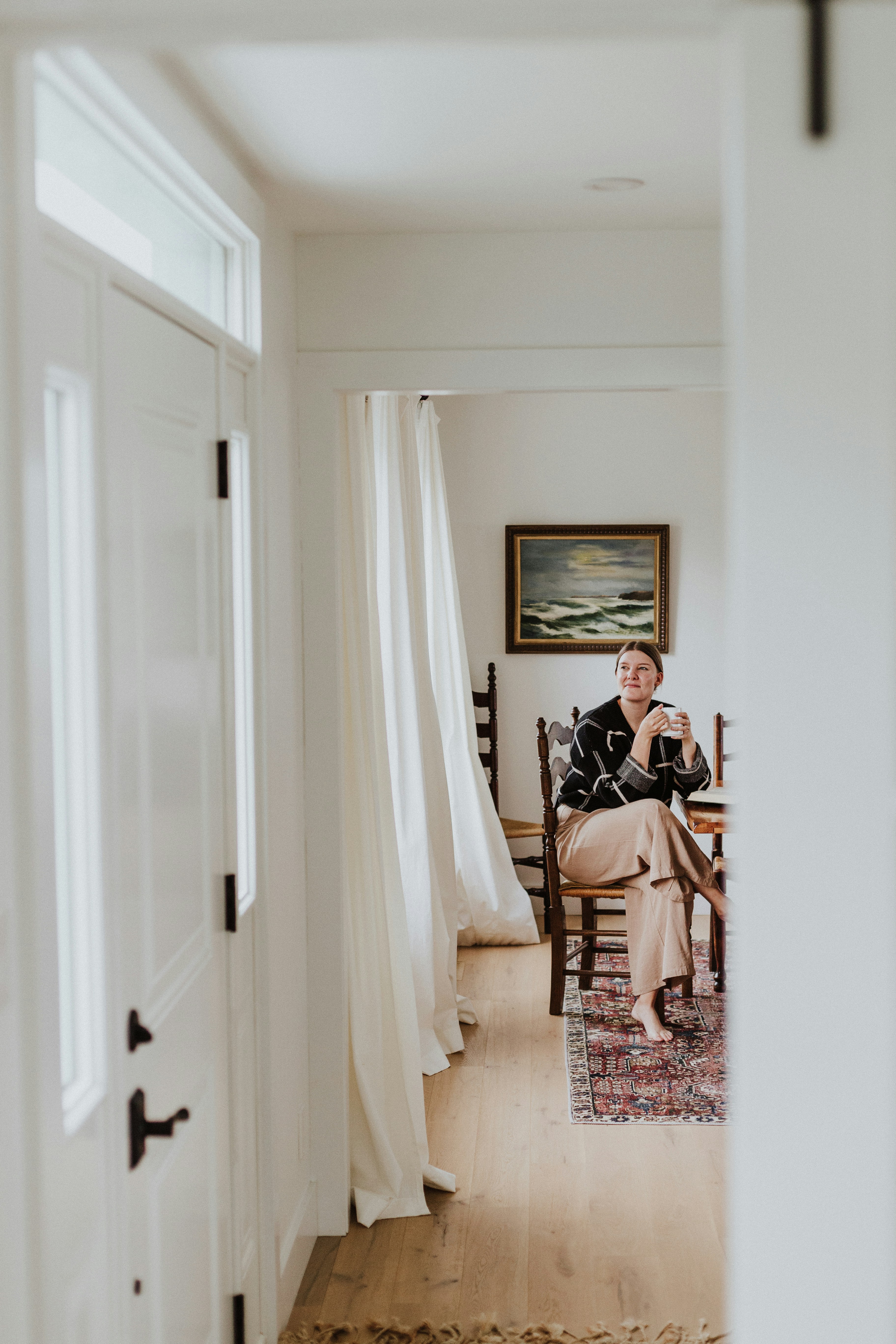 A man sitting in a chair in a living room
