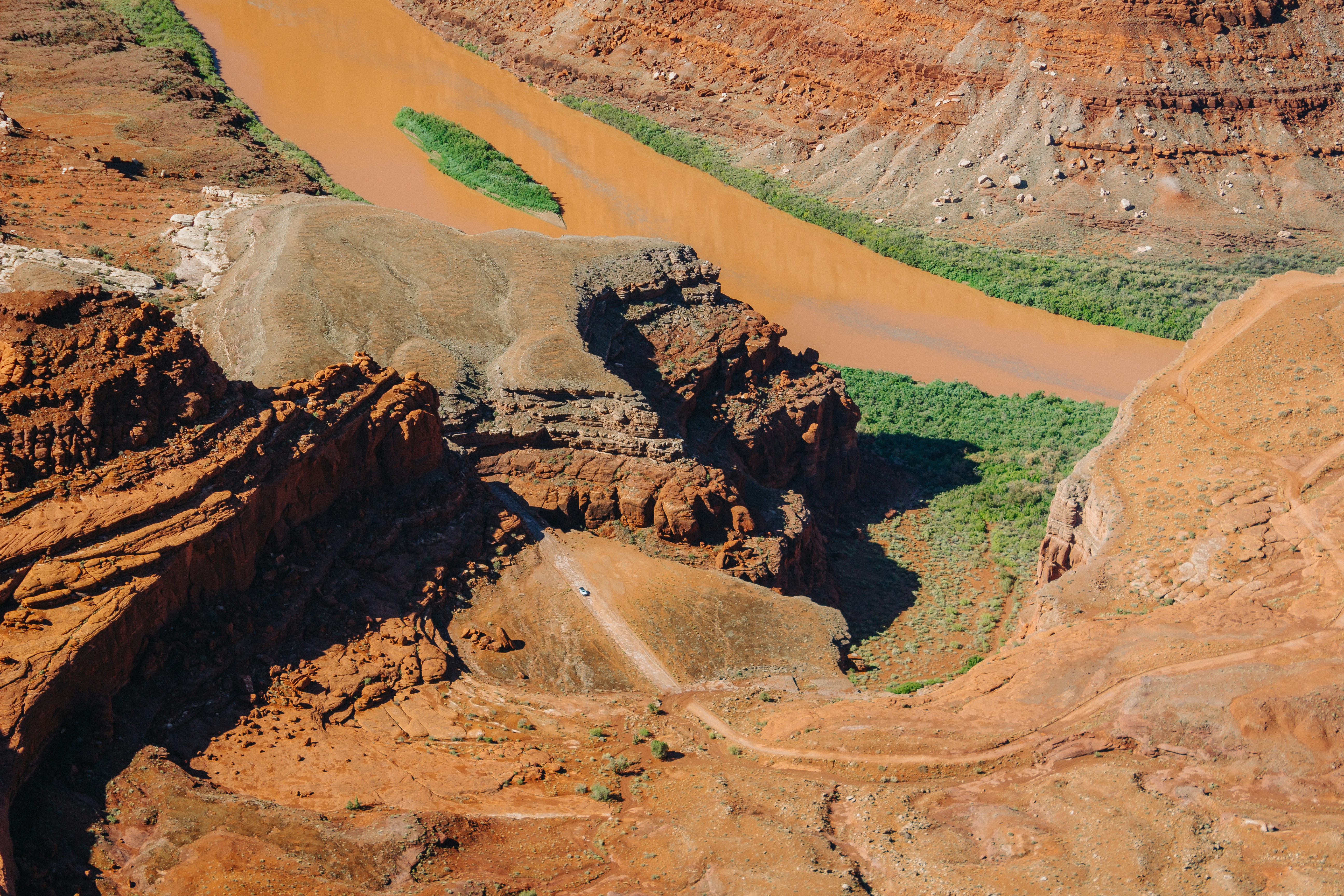 An aerial view of a canyon with a river running through it