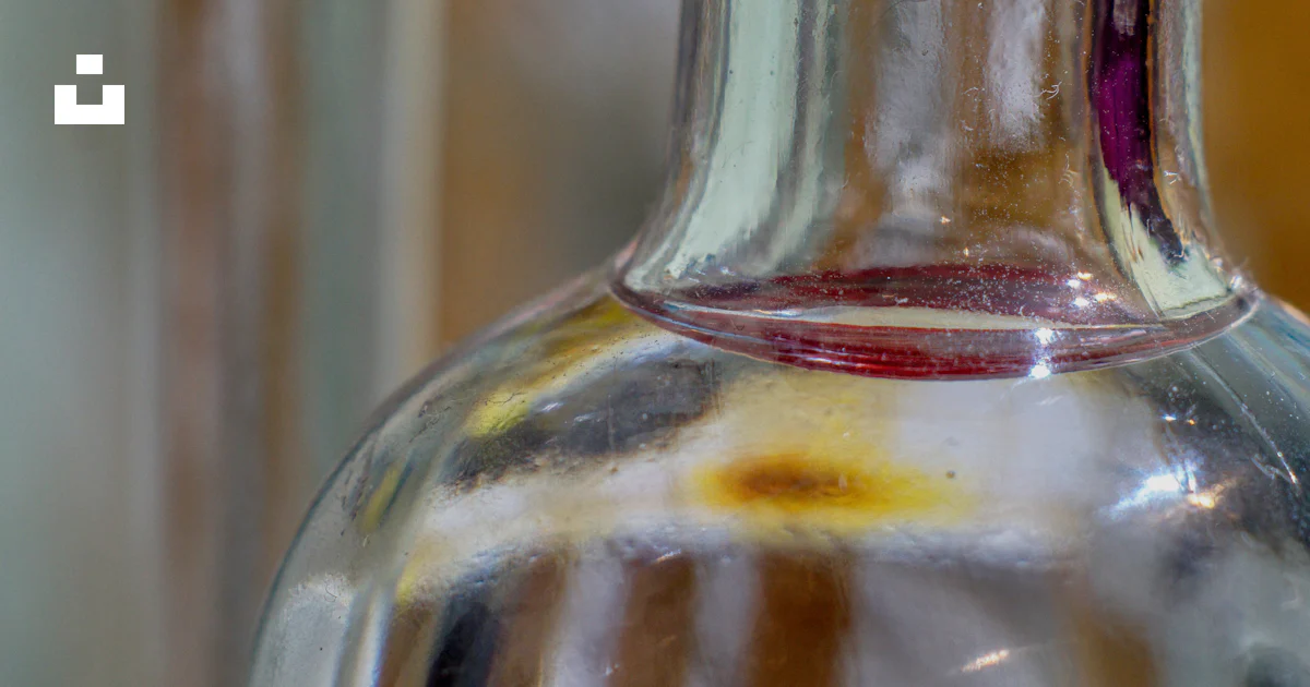 Achaol A close up of a bottle of alcohol photo – Free Wine Image on Unsplash
