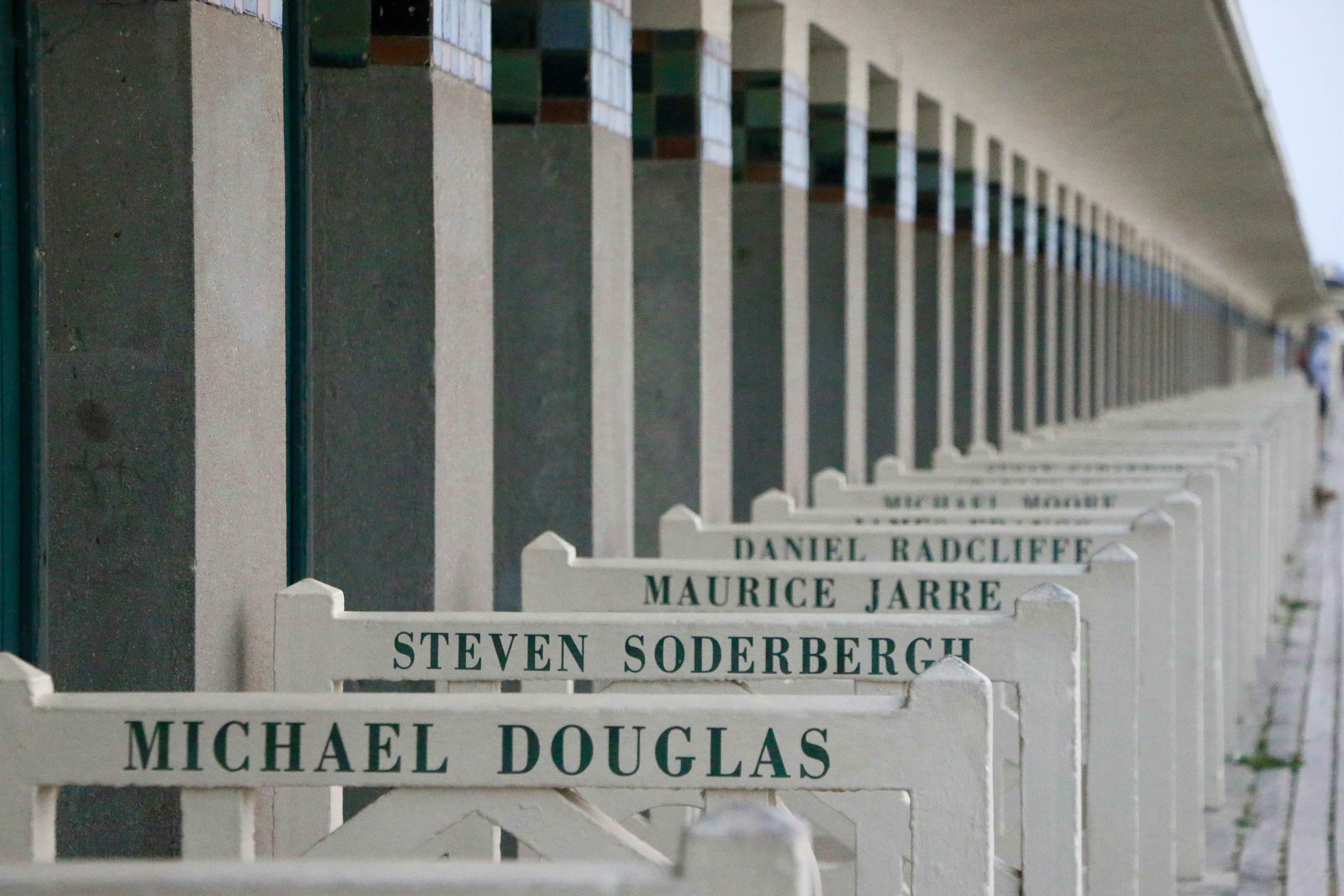 A row of white signs sitting next to each other