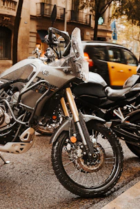 A couple of motorcycles parked next to each other