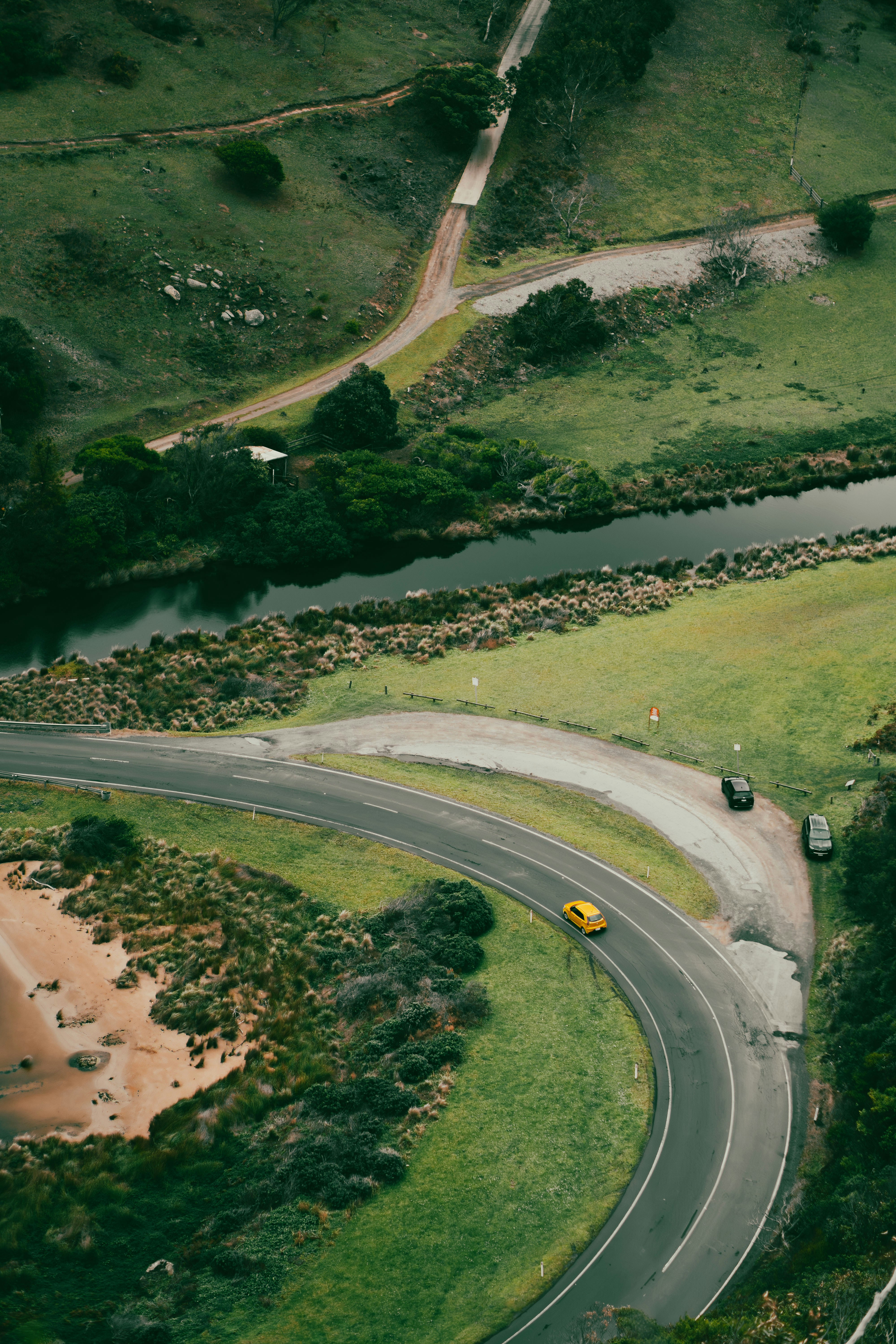 An aerial view of a winding road in the countryside