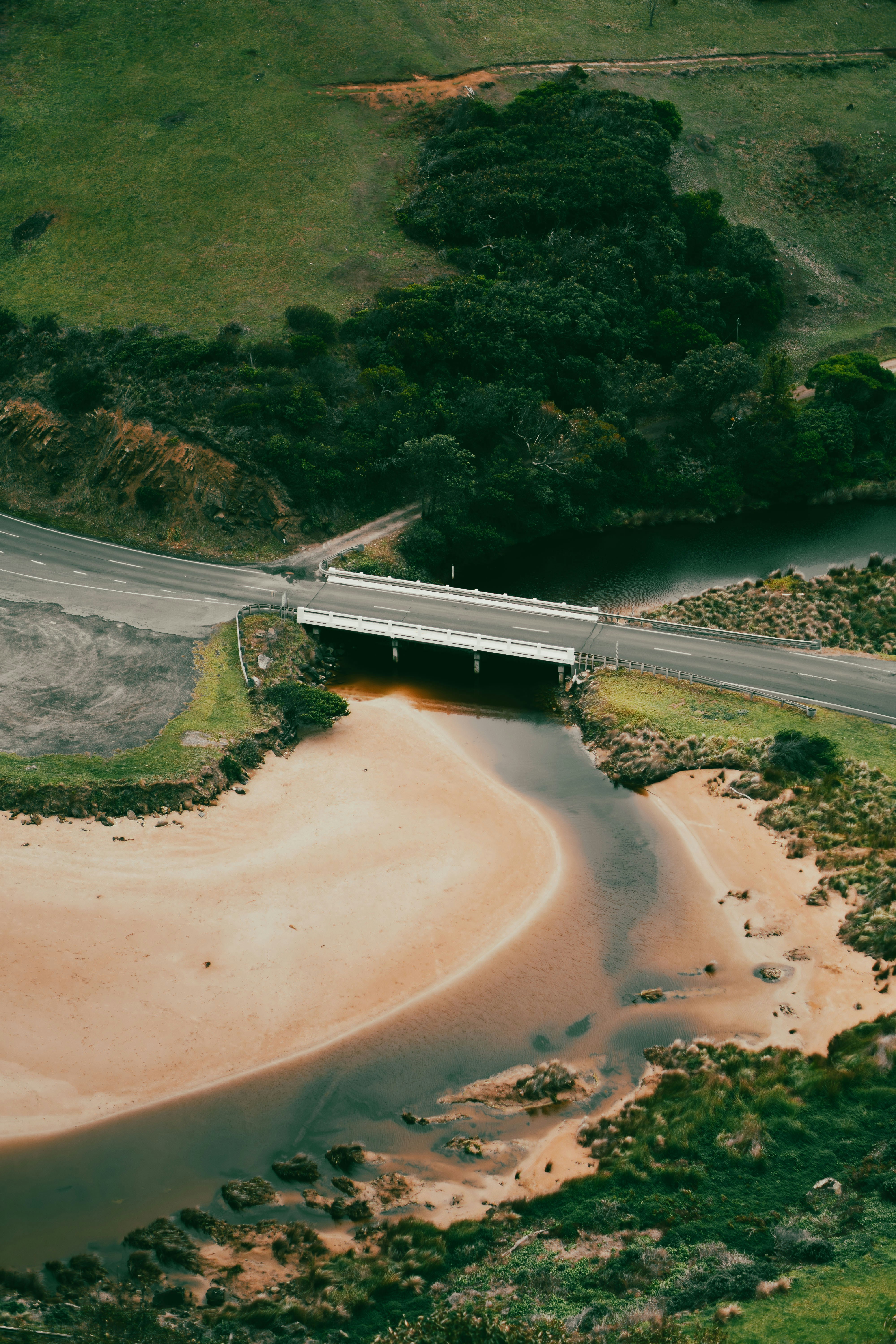 An aerial view of a bridge over a body of water