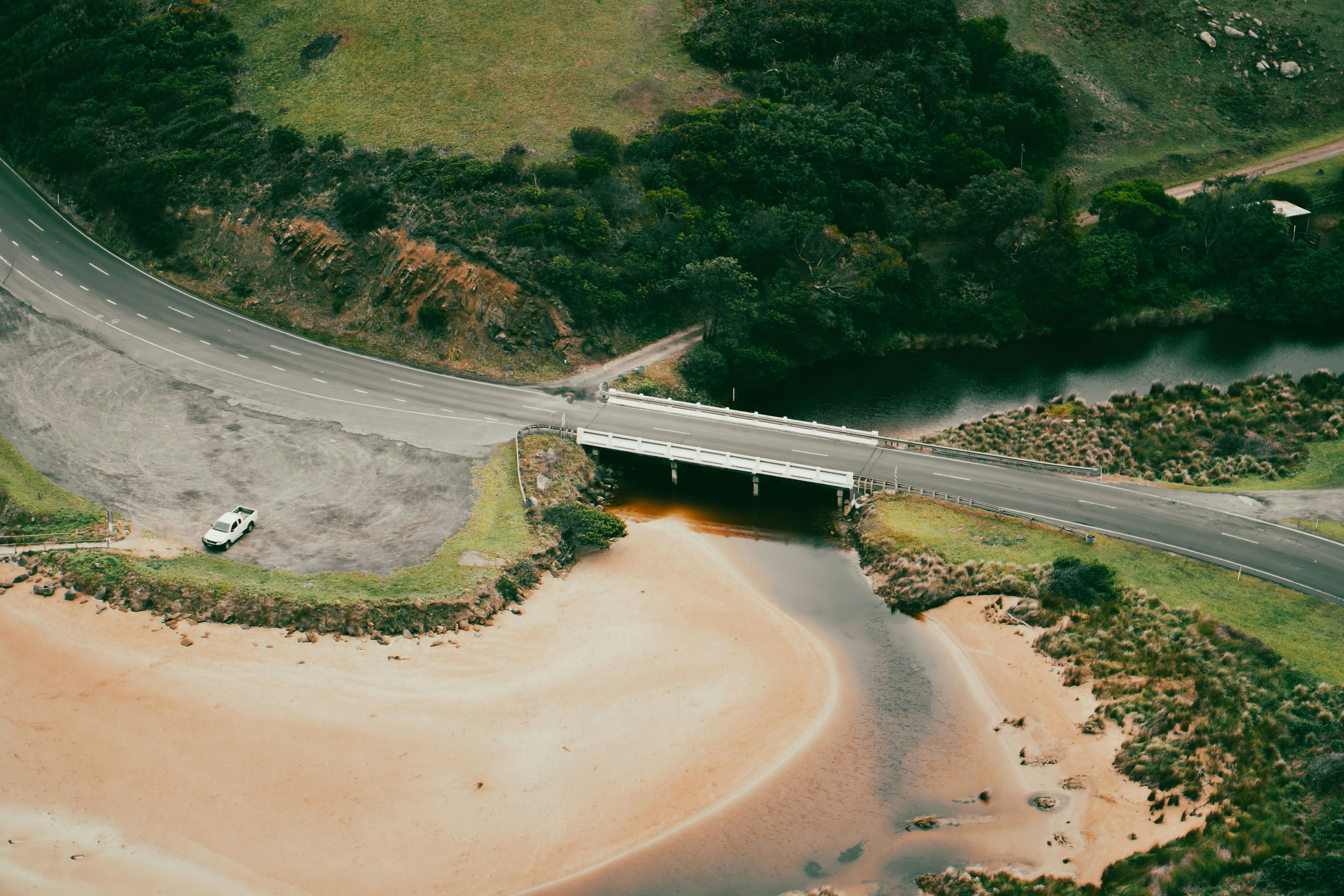 An aerial view of a bridge over a body of water