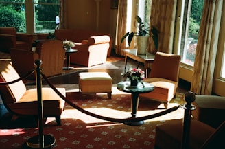 A living room filled with furniture and windows