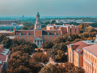 An aerial view of a campus with a clock tower