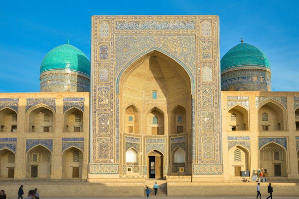 A group of people standing in front of a building — Bukhara, Uzbekistan