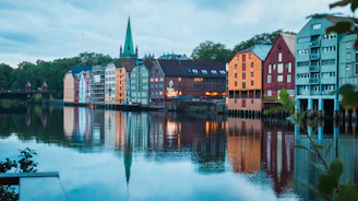 A body of water with a bunch of buildings in the background