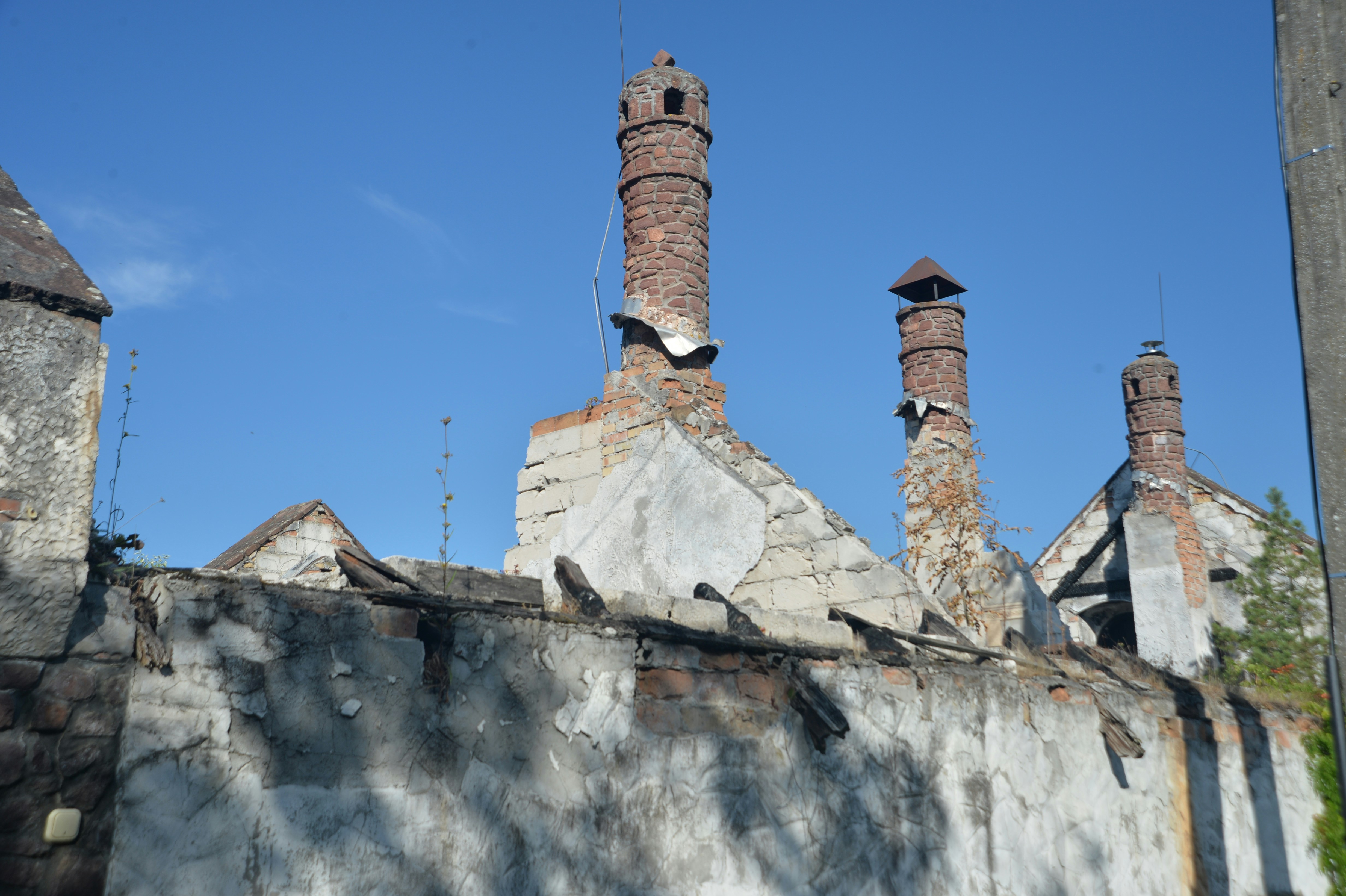 An old building with chimneys on a sunny day