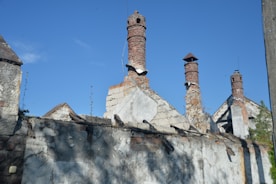 An old building with chimneys on a sunny day
