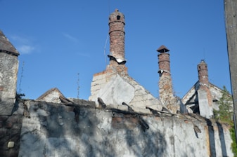 An old building with chimneys on a sunny day