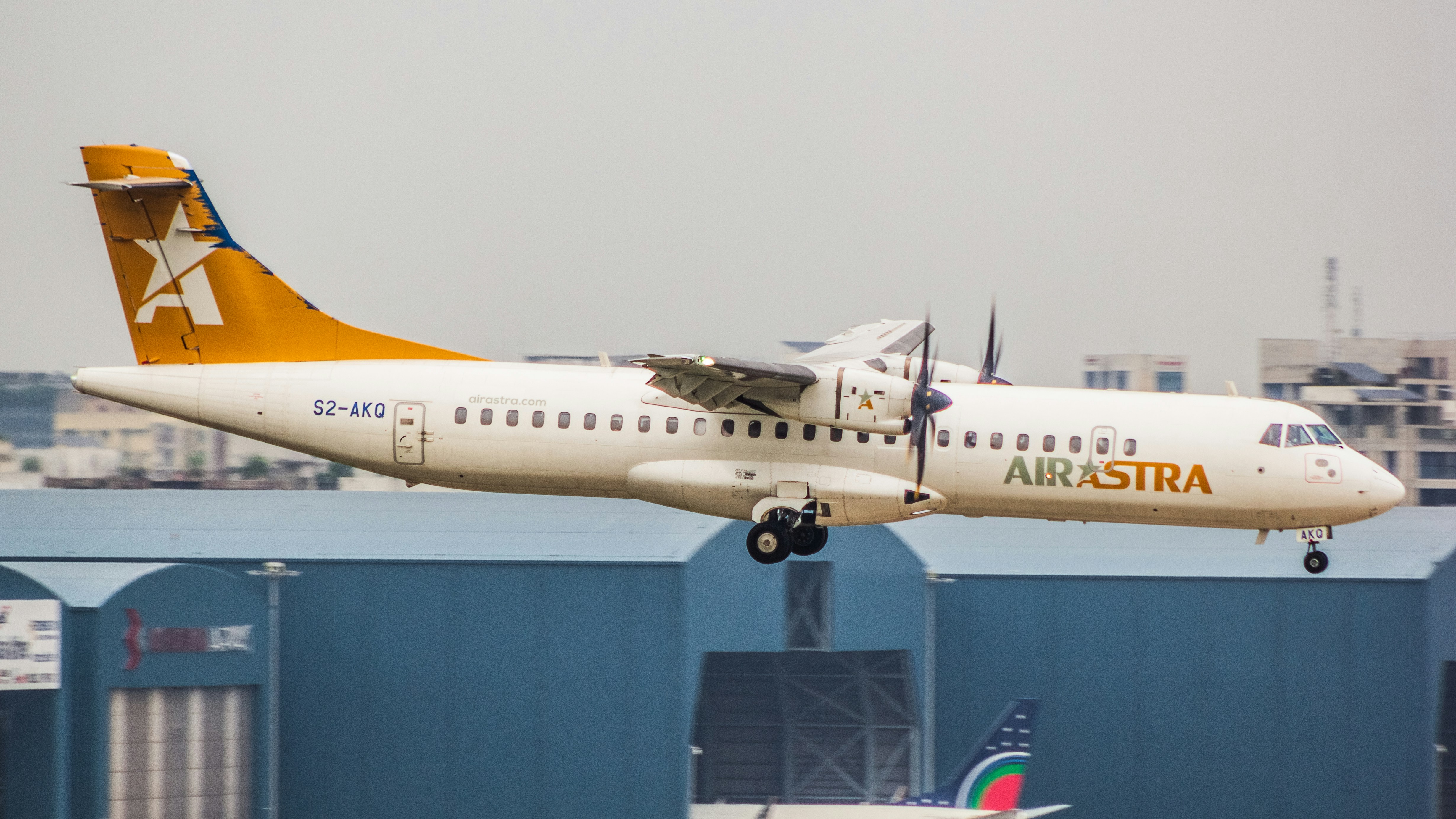 An airplane taking off from an airport runway