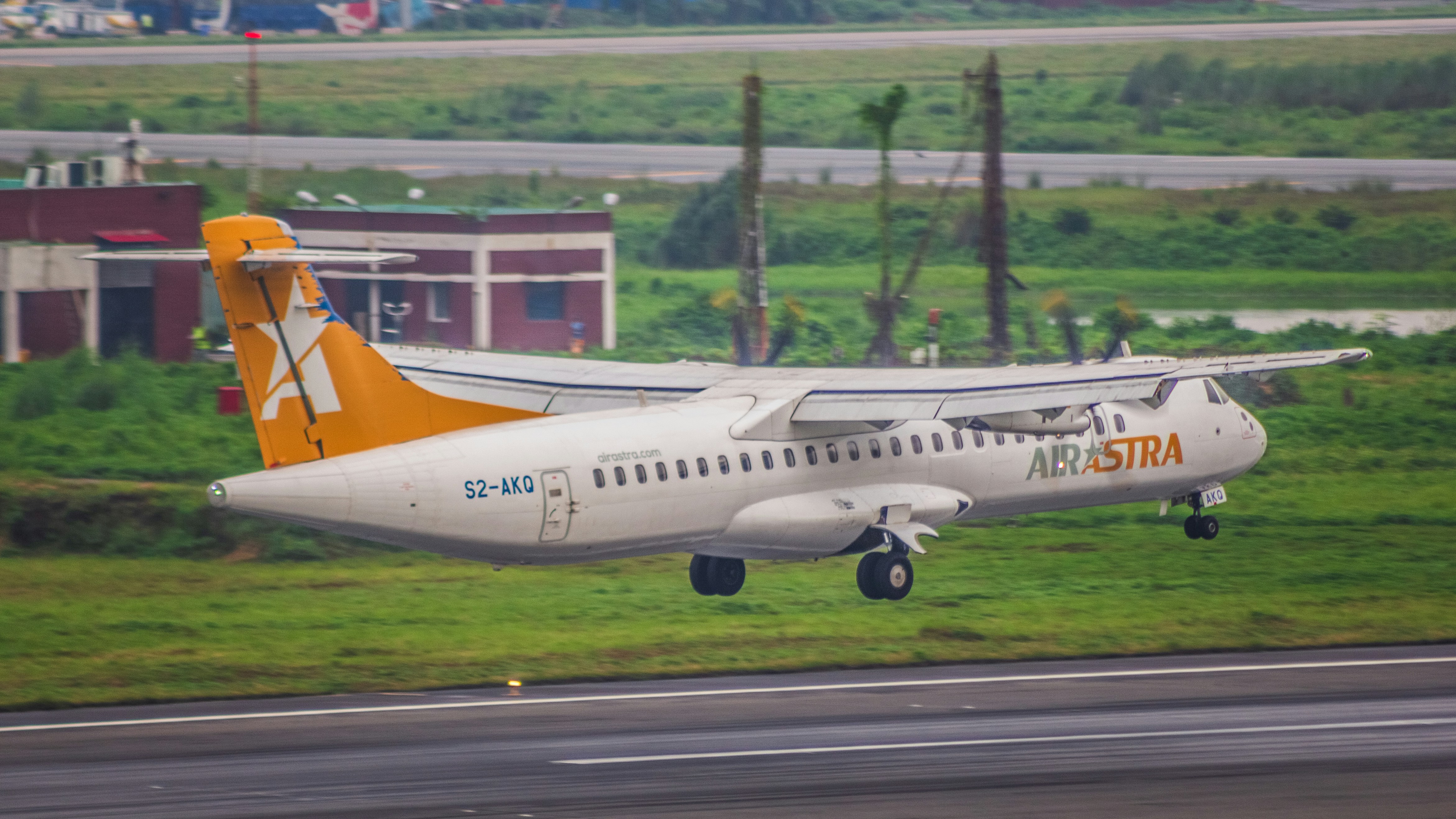 An airplane taking off from an airport runway, 