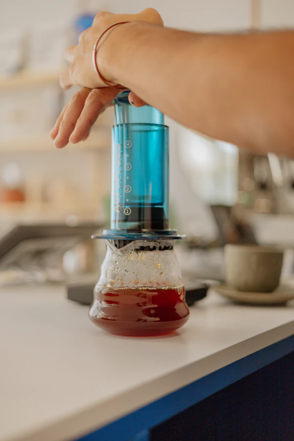Portable blender being used on a kitchen counter