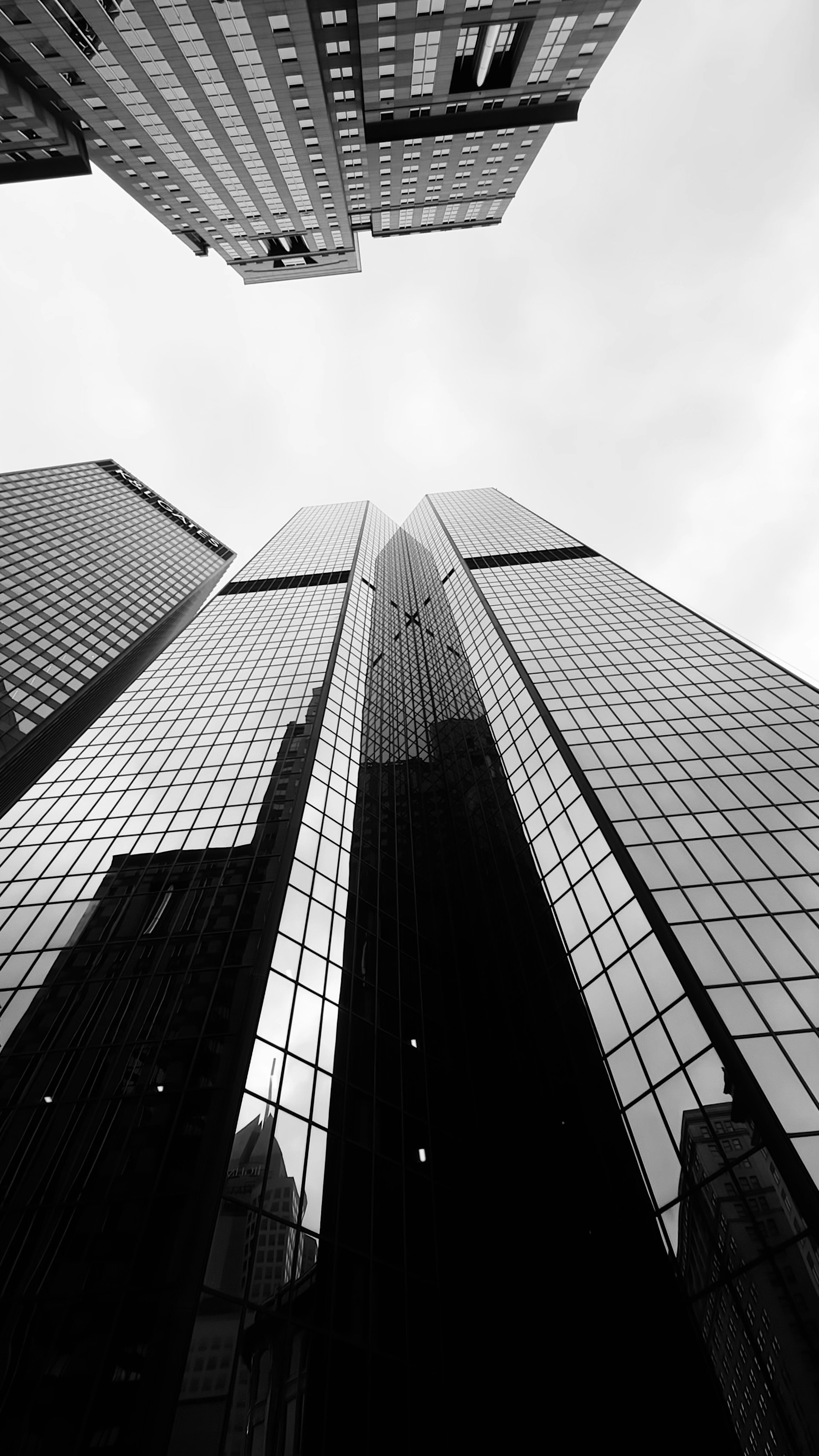 A black and white photo of tall buildings