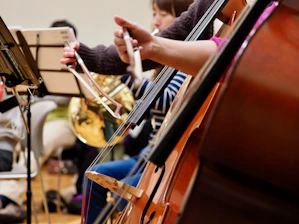 A group of people playing musical instruments in a room