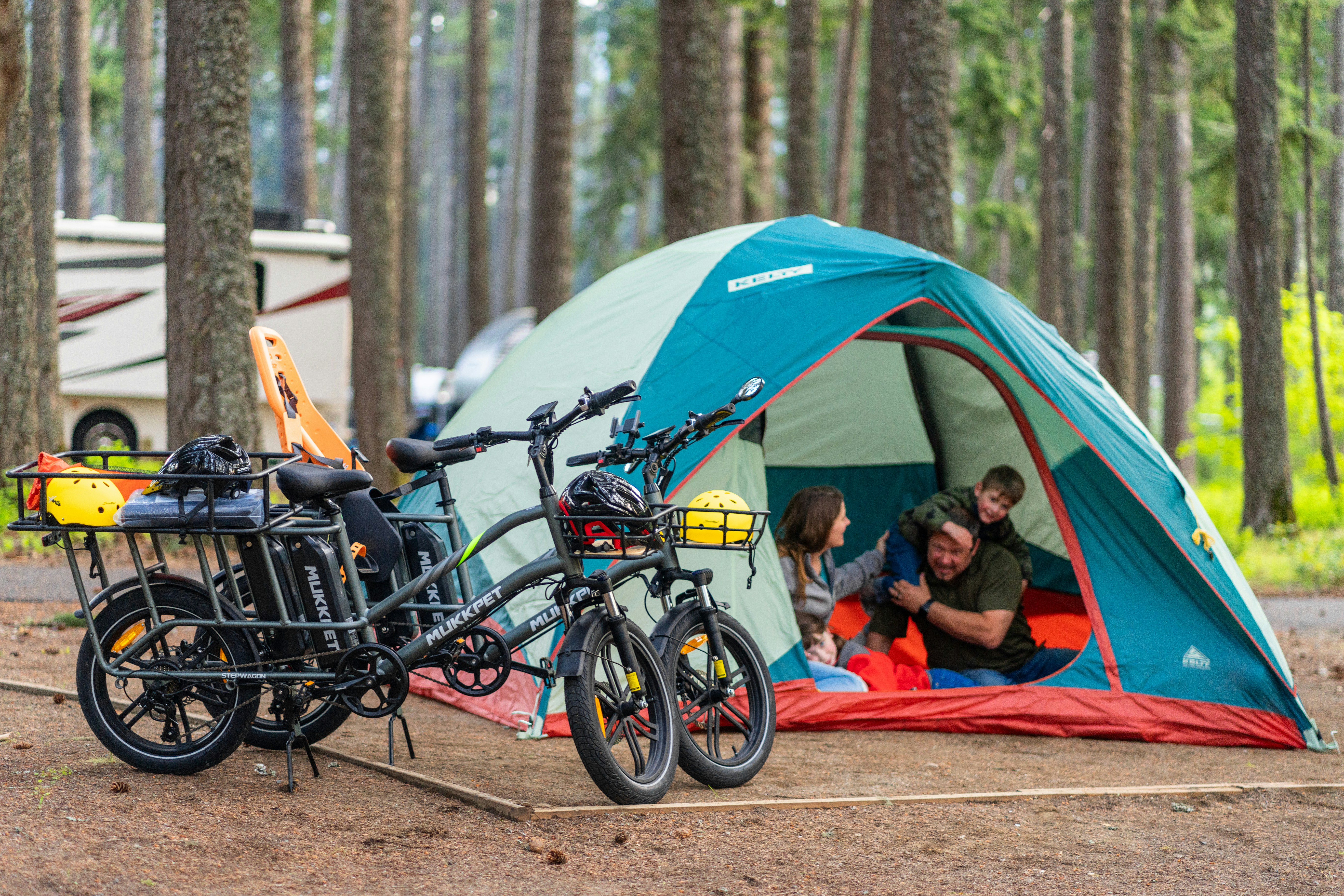 A couple of bikes parked next to a tent
