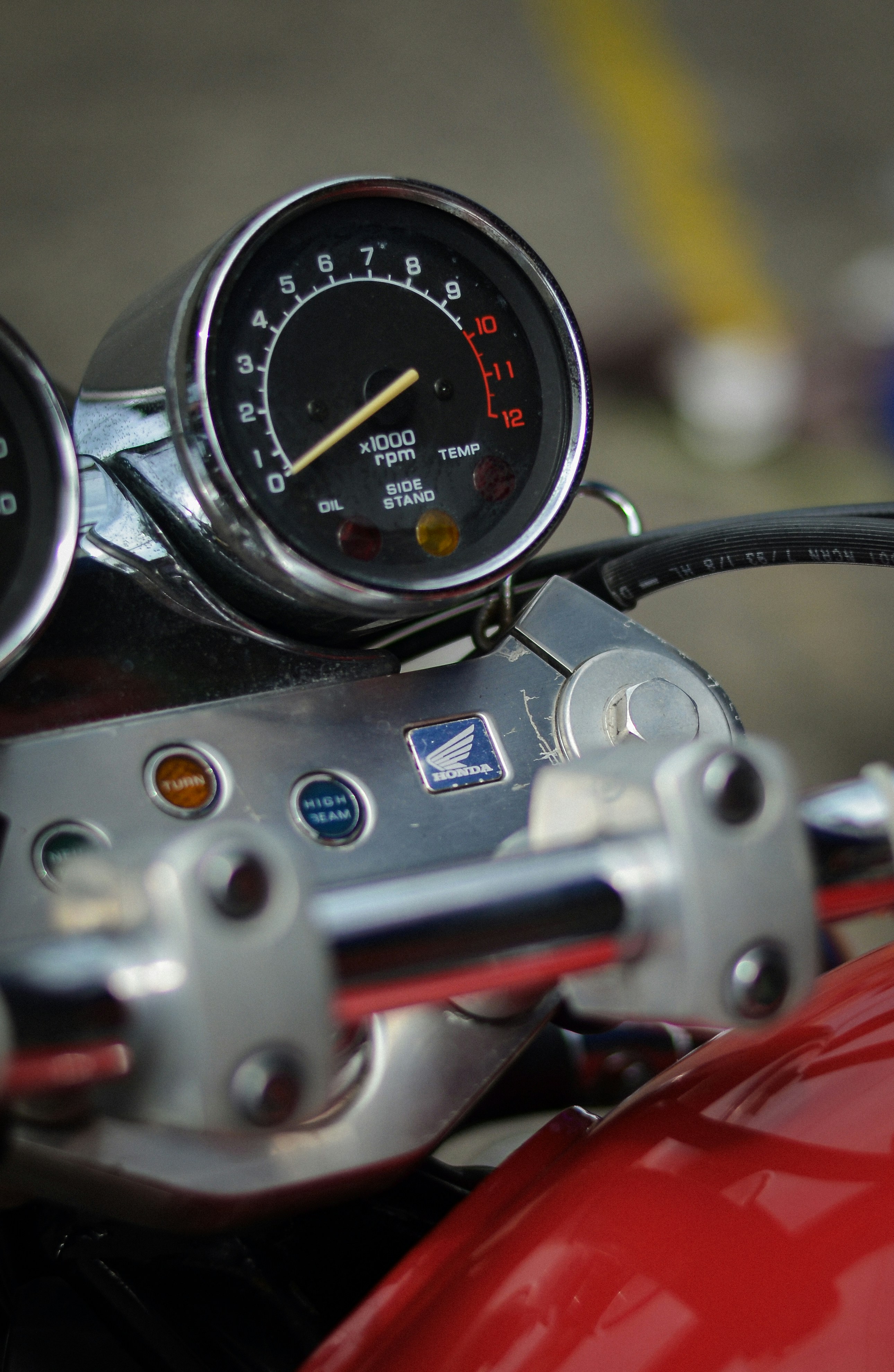 A close up of a speedometer and gauges on a motorcycle