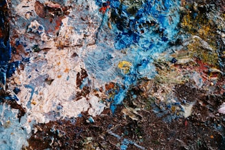 A close up of a piece of art with paint on it