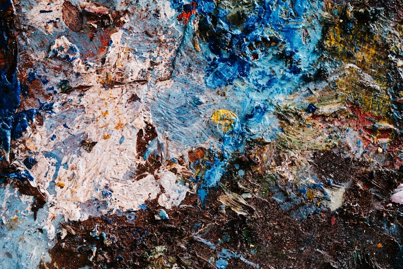 A close up of a piece of art with paint on it